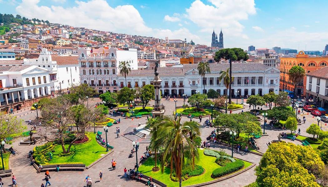 View of Plaza Grande and the historic center of Quito, Ecuador, surrounded by colonial architecture and city landmarks.